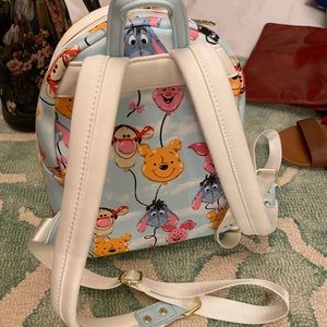 Winnie the Pooh and friends loungefly backpack